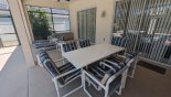 Covered lanai with patio table & 6 chairs from Monterey 1 Villa for rent in Orlando