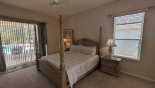 Villa rentals near Disney direct with owner, check out the Master bedroom #1 with 4 poster king sized bed and private pool access