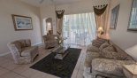 Orlando Villa for rent direct from owner, check out the Beautifully furnished living room with sliding door access to pool deck