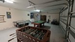 Games room with pool table, air hockey, table foosball, darts and 5 bikes - www.iwantavilla.com is the best in Orlando vacation Villa rentals