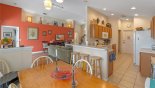 View of kitchen from dining area - breakfast bar with 3 bar stools with this Orlando Villa for rent direct from owner