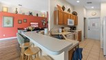 Villa rentals in Orlando, check out the View of kitchen and breakfast bar with 3 bar stools