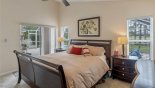 Spacious rental Highlands Reserve Villa in Orlando complete with stunning Master bedroom with private access to pool deck