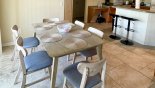 Spacious rental Highlands Reserve Villa in Orlando complete with stunning Dining table with 6 chairs with view of pool.