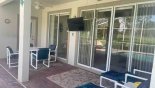 Covered lanai with new outdoor LCD TV so you can watch your the game by the pool side from Dartmouth 2 Villa for rent in Orlando