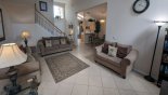 Spacious rental Highlands Reserve Villa in Orlando complete with stunning Family room viewed towards kitchen & dining area