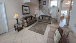 Family room viewed towards entrance foyer and kitchen / dining (right) from Highlands Reserve rental Villa direct from owner