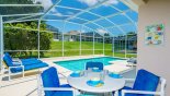 Covered lanai with patio table & 4 chairs - www.iwantavilla.com is the best in Orlando vacation Villa rentals