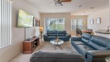 Spacious rental Highlands Reserve Villa in Orlando complete with stunning Grreat room with ample seating to watch the large wall mounted LCD cable TV