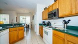 Fully fitted kitchen viewed towards dining area with this Orlando Villa for rent direct from owner