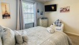 Villa rentals in Orlando, check out the Master bedroom #3 with wall-mounted 4K Smart TV