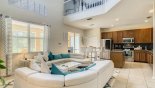 Family room with views ont pool deck - note entertainment loft above with this Orlando Villa for rent direct from owner