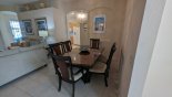 Villa rentals near Disney direct with owner, check out the Dining area viewed towards kitchen via arch and great room to left