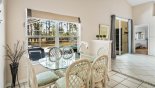 Dining area with dining table & 6 chairs - views onto pool deck - www.iwantavilla.com is the best in Orlando vacation Villa rentals