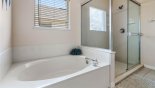 Villa rentals near Disney direct with owner, check out the Master ensuite bathroom with bath, walk-in shower & his 'n' hers sinks & WC