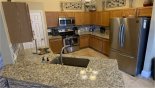 Fully fitted kitchen with granite countertops & quality stainless steel appliances from Mystical 1 Villa for rent in Orlando