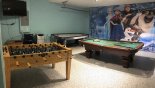 Games room with Frozen-theming incorporating a pool table, air hockey, Foosball & TV - www.iwantavilla.com is your first choice of Villa rentals in Orlando direct with owner