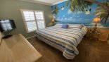 Bedroom #2 with king-sized bed & Moana theming with this Orlando Villa for rent direct from owner