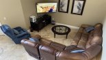 Villa rentals in Orlando, check out the Cosy living room has comfy sofa, armchair, a 55