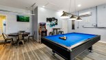 Games room with pool table,  arcade machine, wall mounted TV, poker table and more... from Highlands Reserve rental Villa direct from owner