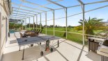 Outdoor ping pong table and gas BBQ station - www.iwantavilla.com is the best in Orlando vacation Villa rentals