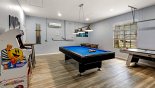 Air conditioned games room with pool table, air hockey, arcade machine and more... from Highlands Reserve rental Villa direct from owner