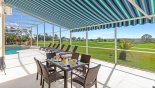 Alfreco dining under the retractable awning offering welcome shade - seats 6 persons with this Orlando Villa for rent direct from owner