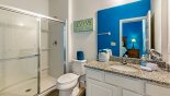 Ensuite bathroom to bedroom #9 with walk-in double shower, single vanity & WC - www.iwantavilla.com is the best in Orlando vacation Villa rentals