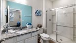 Ensuite bathroom to bedroom #6 with walk-in double shower, single vanity & WC - www.iwantavilla.com is the best in Orlando vacation Villa rentals