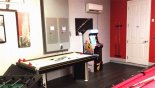 Villa rentals in Orlando, check out the Games room with air hockey and PacMan arcade machine