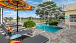 Additional 5 sun loungers with parasol at other end of the large pool deck from Formosa Gardens rental Villa direct from owner