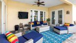 Villa rentals in Orlando, check out the Covered lanai with soft seating and wall mounted outdoor LCD TV (covered)