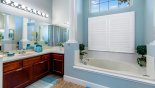 Master ensuite bathroom #1 with roman bath, walk-in shower, his & hers sinks & separate WC from Captiva 1 Villa for rent in Orlando