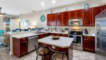 Fully fitted kitchen with stainless steel appliances and Corian counter tops - www.iwantavilla.com is the best in Orlando vacation Villa rentals