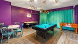 Games room with AC, pool table, air hockey & table foosball from Magna Bay 1 Villa for rent in Orlando