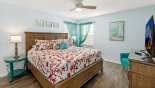 Master bedroom #3 with coral theming and king sized bed from Emerald Island Resort rental Villa direct from owner