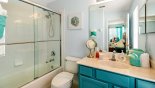 Master #3 ensuite bathroom with bath & shower over, single sink & WC from Emerald Island Resort rental Villa direct from owner