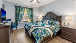 Spacious rental Emerald Island Resort Villa in Orlando complete with stunning Ground floor master bedroom #1 with king sized bed & views onto pool deck