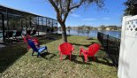 Spacious fenced off garden area to the right of pool deck, ideal for outdoor games, or relaxing in the shade of the tree with this Orlando Villa for rent direct from owner