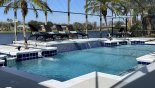 60' wide pool deck with waterfall features - the deck gets the sun all day from Sanibel 1 Villa for rent in Orlando