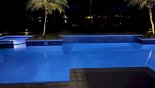 Pool at night with colour changing underwater lighting - www.iwantavilla.com is your first choice of Villa rentals in Orlando direct with owner