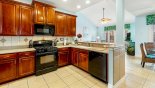 Spacious rental Formosa Gardens Villa in Orlando complete with stunning Fully fitted kitchen viewed towards family room and adjacent breakfast nook