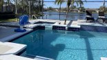 Spa in corner and poolside basketball game for the kids from Sanibel 1 Villa for rent in Orlando