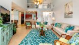 Family room viewed towards kitchen - note cathedral ceiling & minstrel gallery above - www.iwantavilla.com is your first choice of Villa rentals in Orlando direct with owner