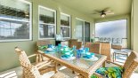 Villa rentals in Orlando, check out the Covered lanai with patio table & 6 chairs - perfect for alfresco dining