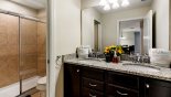 Family bathroom #5 with walk-in double shower, single vanity & WC - set between bedrooms #6 & #7 with this Orlando Villa for rent direct from owner