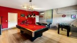 Air conditioned games room with pool table, air hockey, table foosball and more... - www.iwantavilla.com is the best in Orlando vacation Villa rentals