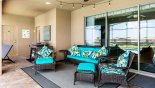 Comfortable soft seating under covered lanai - ideal for relaxing & watching the sunset with a drink from Baymont 1 Villa for rent in Orlando