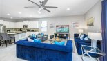 Villa rentals in Orlando, check out the Family room with 2 sofas and 2 armchairs to watch the large Roku enabled LCD Smart TV in comfort