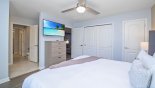 Orlando Villa for rent direct from owner, check out the Bedroom #4 with wall-mounted LCD Smart TV - viewed towards Jack & Jill bathroom